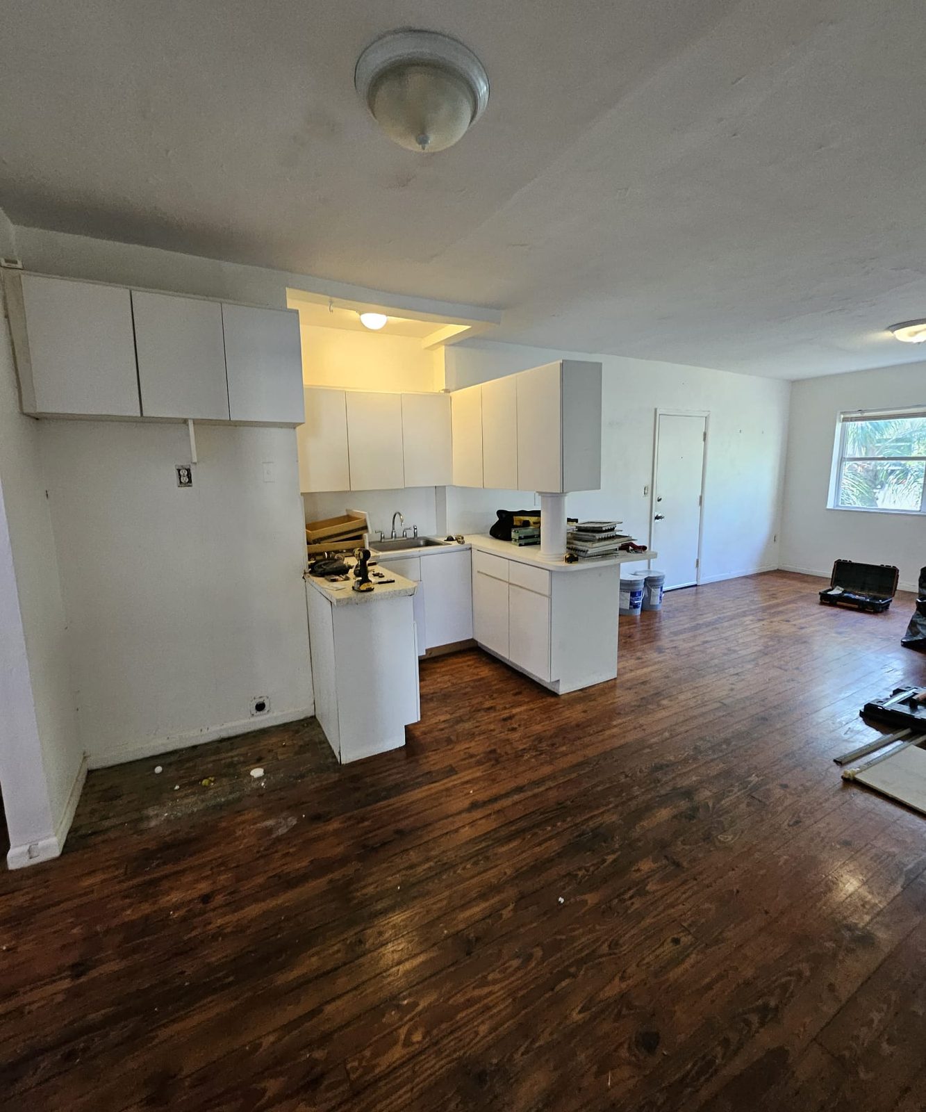 Kitchen and living area before remodeling